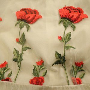 Woman's designer embroidered cocktail dress